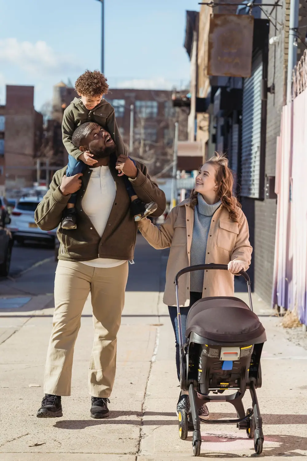Parents and their children enjoying a walk together in the city